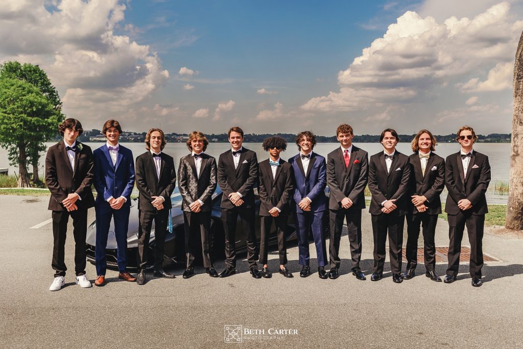 high school senior boys ready for prom posing with a lamborghini Lakeland, FL