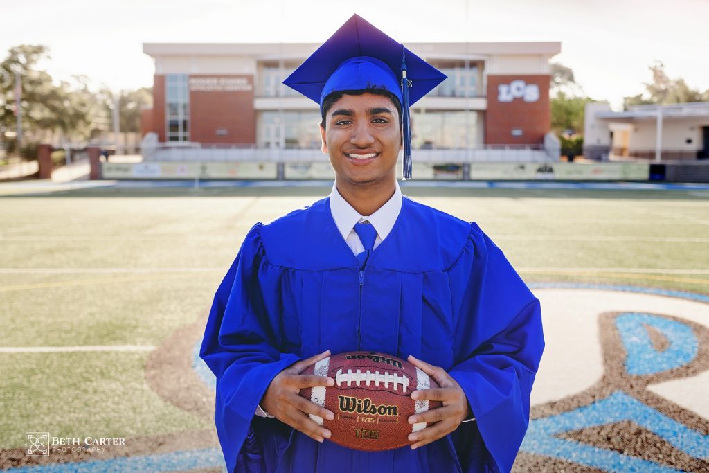 high school senior graduation cap and gown Lakeland Christian School Lakeland, FL - playing football