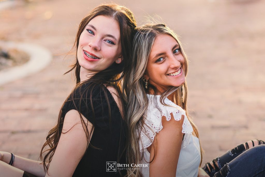 high school sisters at sunset in downtown Lakeland